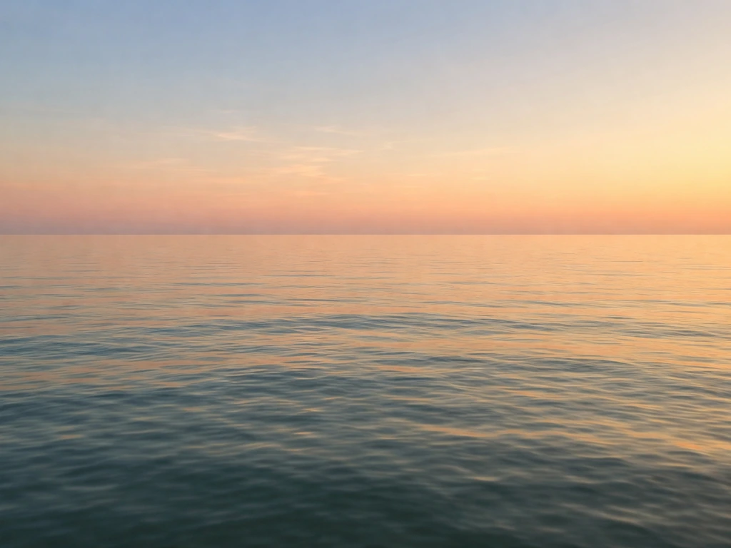 Sunlit calm ocean with gentle ripples and a pastel sky, evoking peaceful halcyon days.