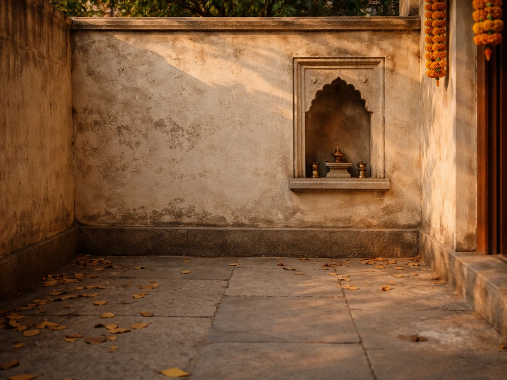 Sunlit courtyard with a small temple wall and a few fallen leaves, symbolizing cultural symbolism